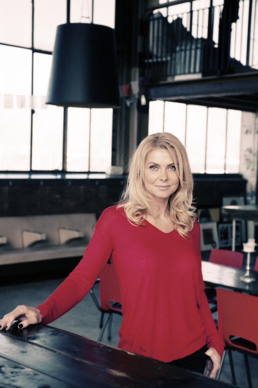 Barbara Rubin, founder of BABSfit, standing in a bright industrial-style loft